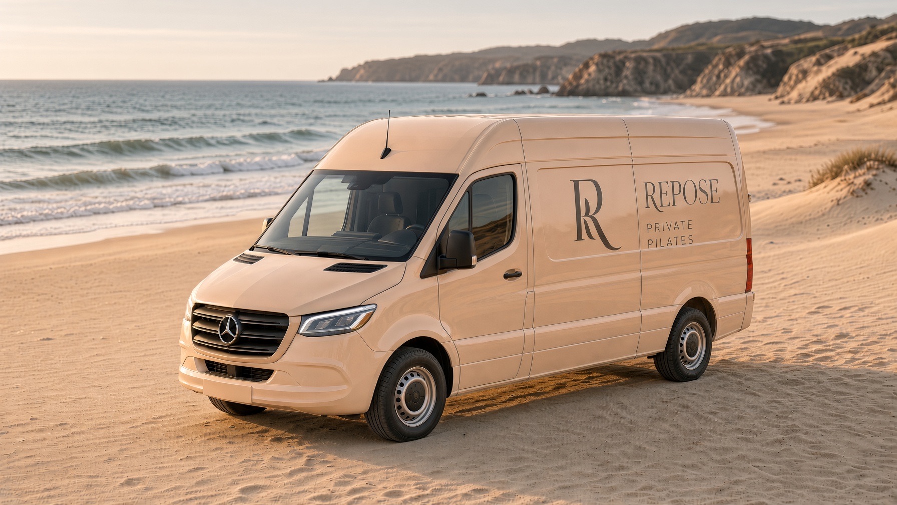 The Repose studio on a sandy beach, with the ocean and coastal cliffs behind